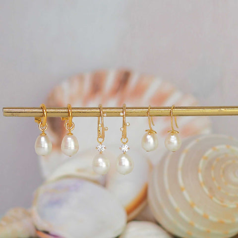 pearl hoops with white topaz detailing